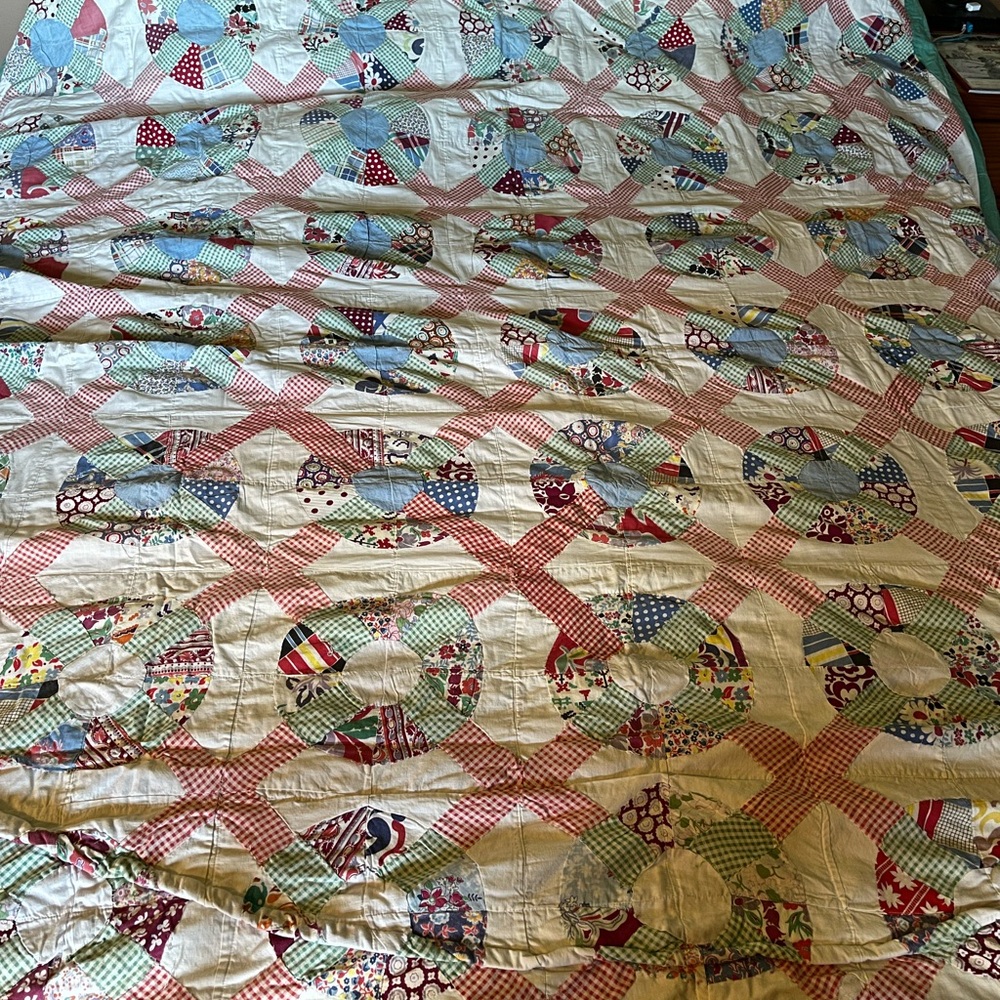Patchwork Quilt with Red and Cream Accents